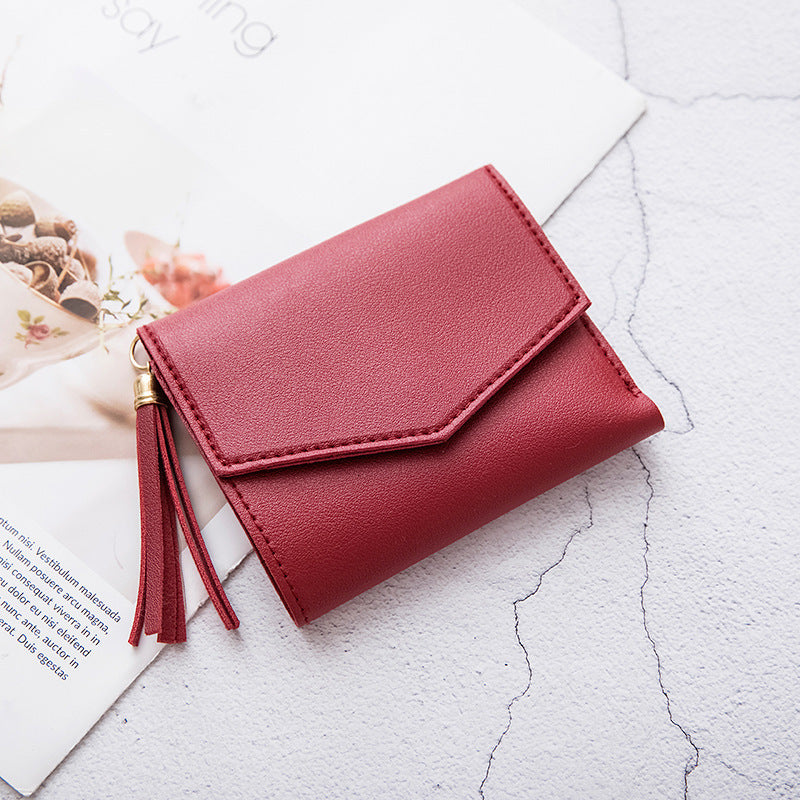 Portefeuille en cuir grainé triple volet
