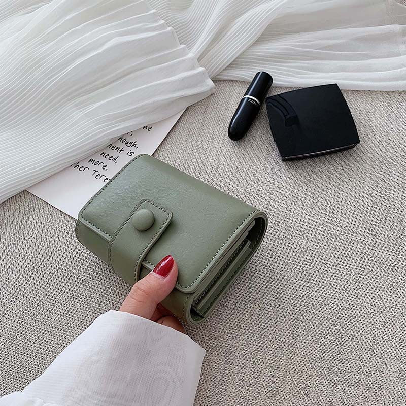 Pochette avec miroir en cuir texturé
